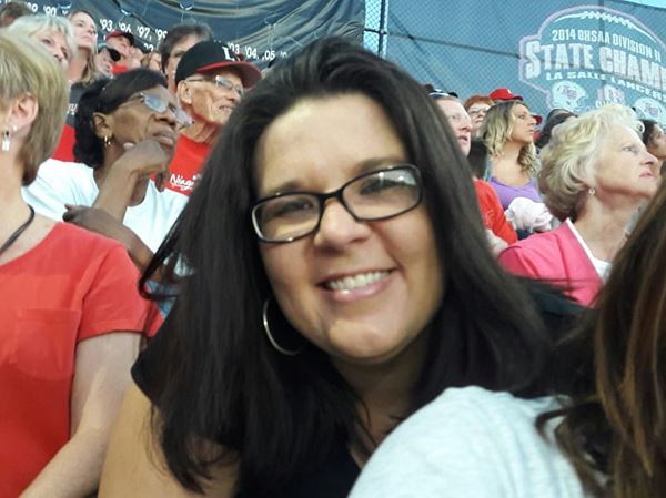 a headshot of Jill Veach in the stands at a sporting event
