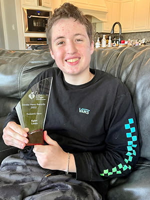 Kyler Lewis with his 2022 Stroke Hero Pediatric award