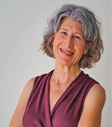 A professional headshot of Lori Gray