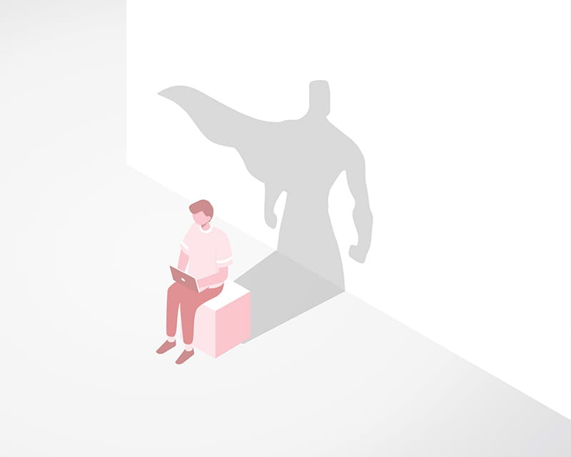 Digital illustration of a man on a laptop with a super hero shadow reflecting on a wall