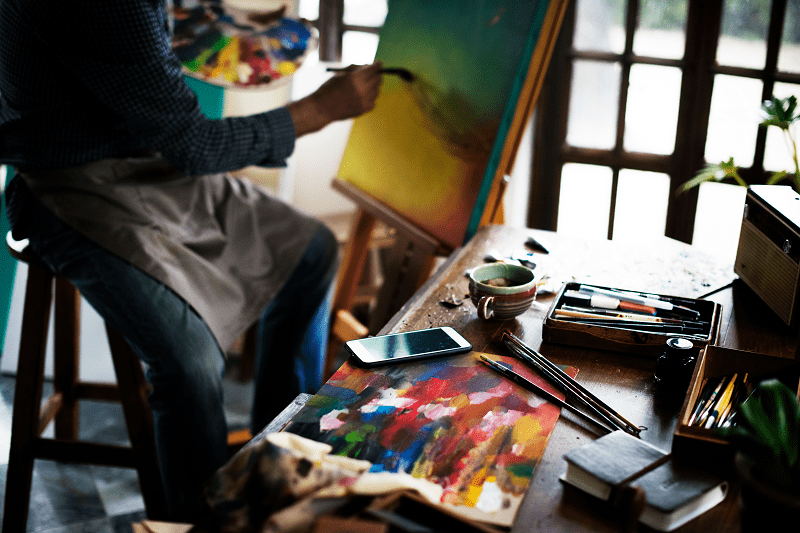 Artist working on a painting Artist working on a painting